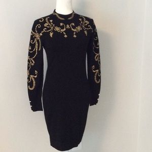 black fitted dress with gold embroidery
